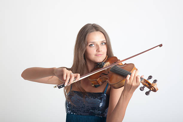 girl playing a violin stock photo