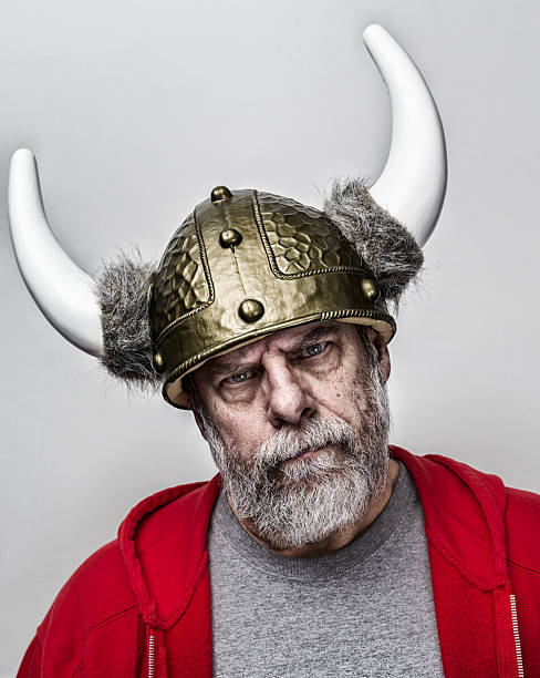 istock Stern Suspicious Horned Helmet Armor Gray Beard Senior Man 517012564