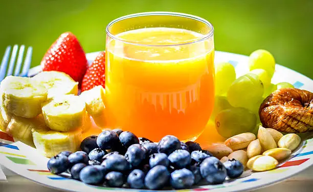 Plate of Fruits, Juice and Nuts for Healthy life