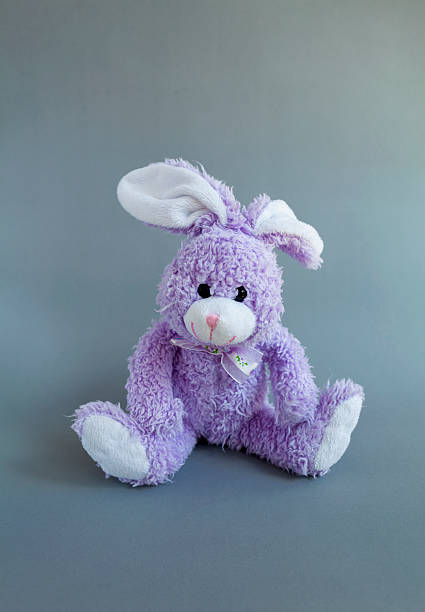 istock Purple rabbit doll on grey background 517013282