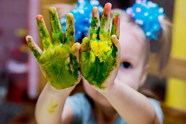 istock Little creative girl draws paints 517013572