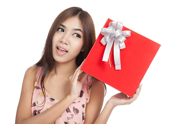 istock Asian woman show red gift box 517014357