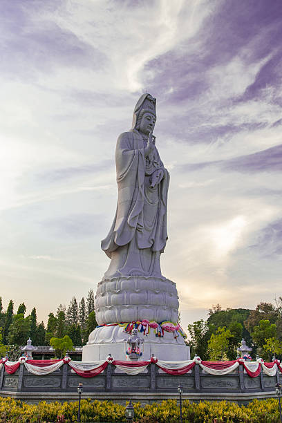 istock Guanyin Buddha statue on blue sky 517014972