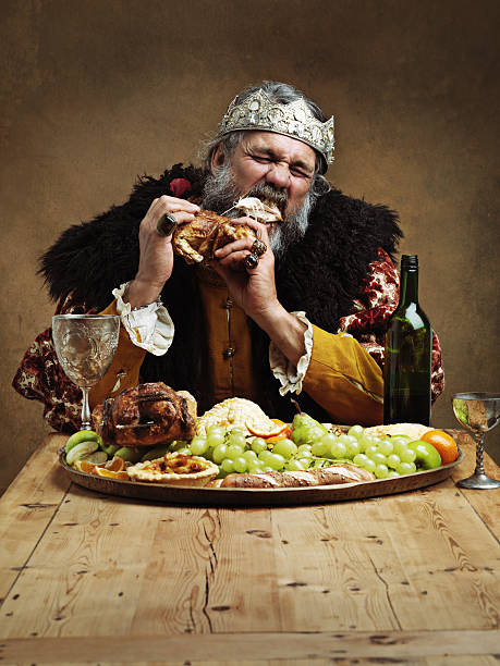 ruling is hungry business! - medieval banquet food dinner party 뉴스 사진 이미지