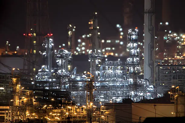 Close up of Oil and gas refinery plant area at twilight.