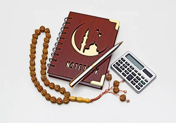 Muslim Notepad with pen, calculator and Tasbeeh.