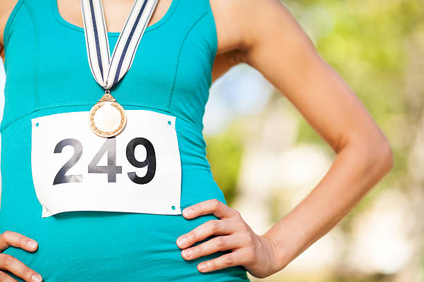 istock Midsection Of Marathon Gold Medalist At Park 517017699
