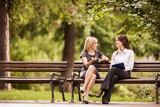 Happy businesswomen communicating.