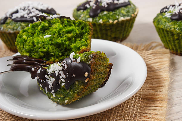 istock Fresh muffins with spinach, desiccated coconut and chocolate glaze 517018684