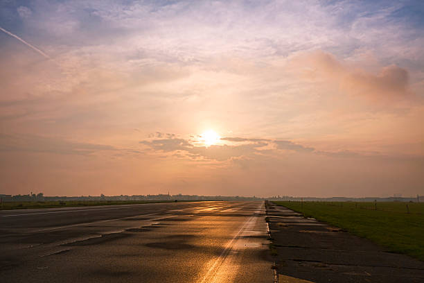 istock straight road to the horizon during the sunset 517018879