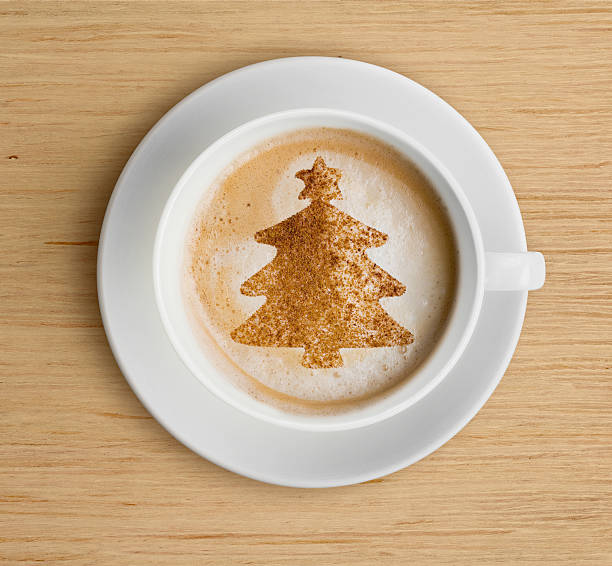 istock coffee cup with foam and christmas tree shape 517019694