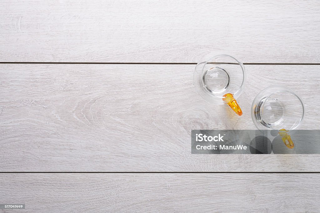 Wooden board and empty glasses wooden board and empty glasses top view Copy Space Stock Photo