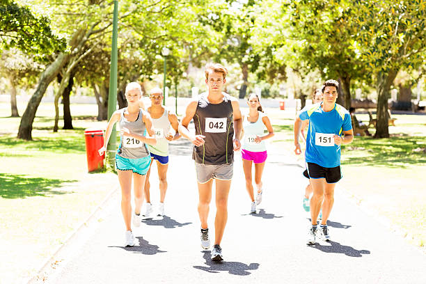 istock Men And Women Running Marathon 517041771