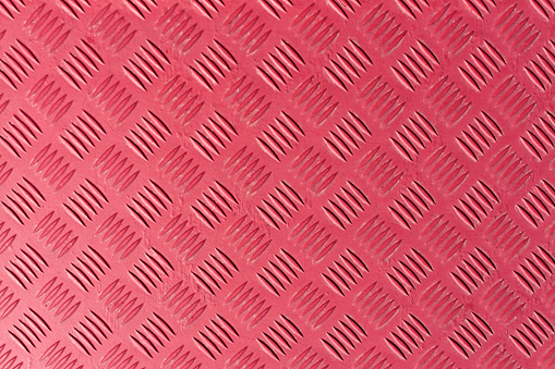 Pink metal textured floor surface. Color background and texture.