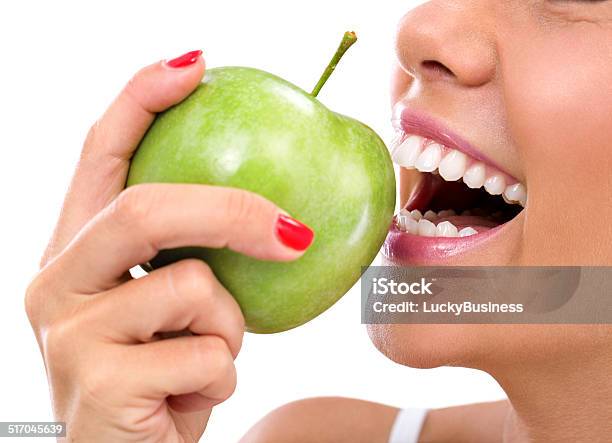 Closeup Of Woman Eating A Green Apple Stock Photo - Download Image Now - Apple - Fruit, Eating, Food