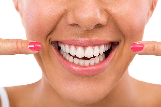 istock Woman showing her perfect teeth 517045659
