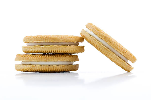 istock Vanilla cookies with cream filling on white background 517045815