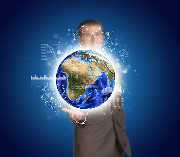 istock Businessman in suit hold Earth with graphs and network 517047067