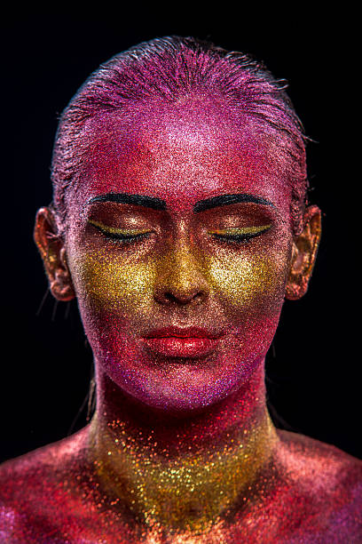 istock Glitter makeup on a beautiful woman face on a black background 517047919