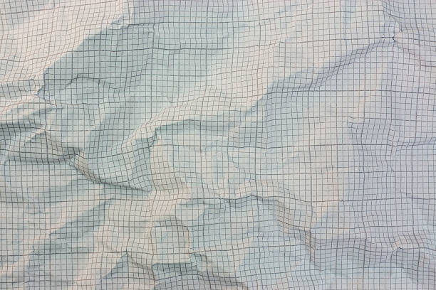 istock Close up of crumpled graph paper 517048318