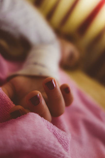 istock Baby girl lying on the bed sleeping 517048344