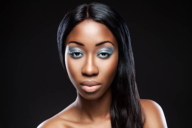 istock Beautiful young black woman with makeup 517048401