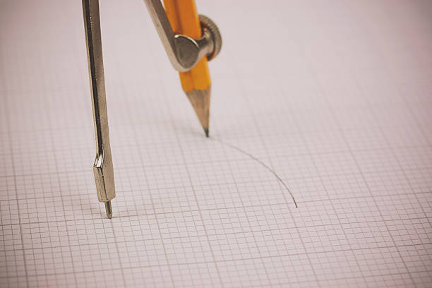 istock Close up of a compass on graph paper 517048744