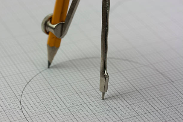 istock Close up of a compass on graph paper 517048776