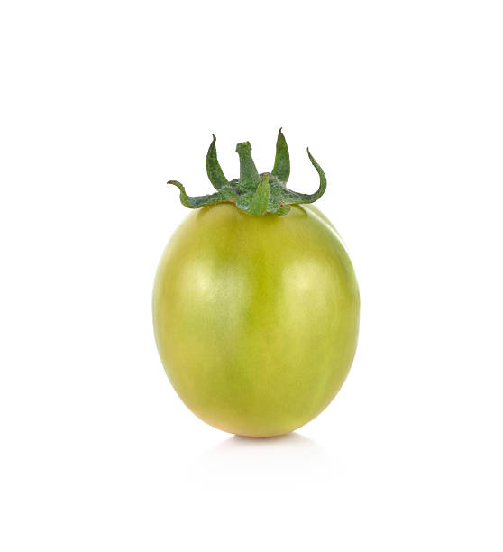 istock Green tomato isolated on white background 517052474