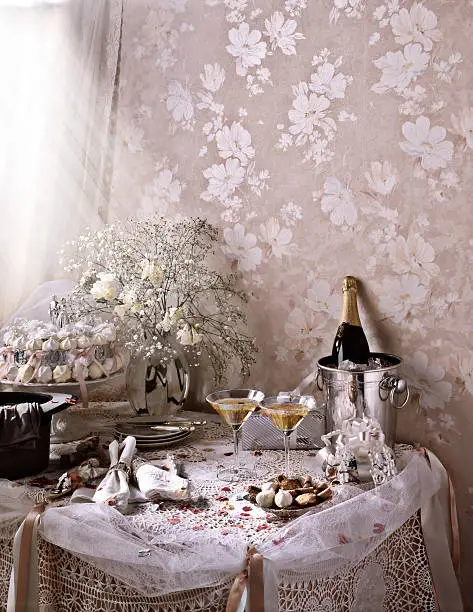 Photo of Wedding Table Themed with Champagne, Top Hat, Flowers