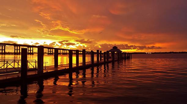istock Sunset Orange Southwest Florida with Dock Silhouette Centennial Park 517054655