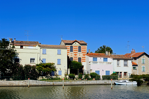 Houses on the canal in Aigues-Mortes in the heart of the Camargue in the south-east of France.