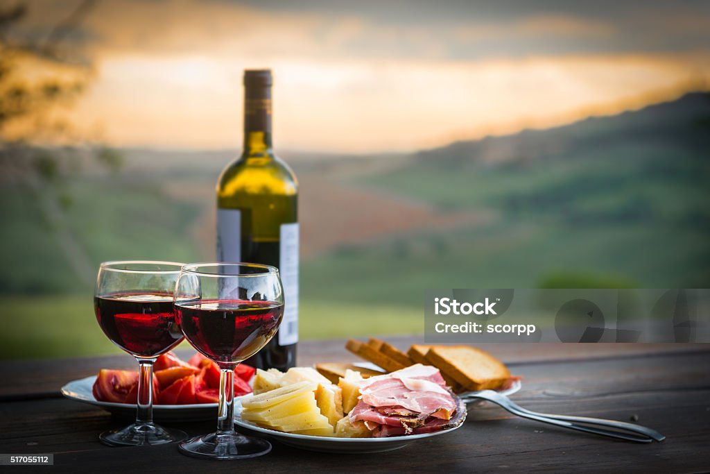 still life Red wine  ,cheese and prosciutto still life Red wine  ,cheese and prosciutto. Romantic dinner  outdoors Wine Stock Photo