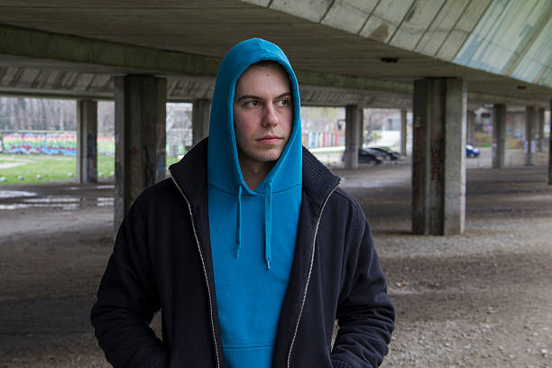istock Young Man With A Blue Hood 23 517055248