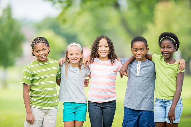 istock Friends Happily Standing Together 517055330