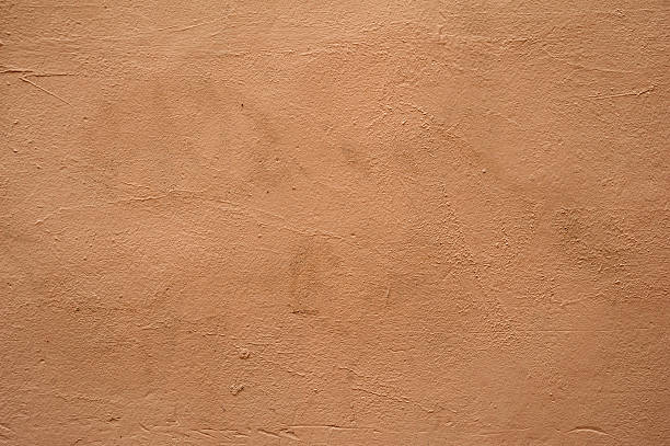 istock Texture of wall covered with brown stucco 517056761