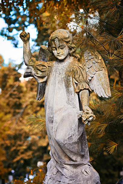 istock Angel with a rose in hand 517057299