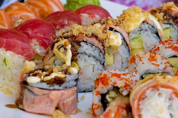 istock Sushi rolls with vassabi on the plate 517057929