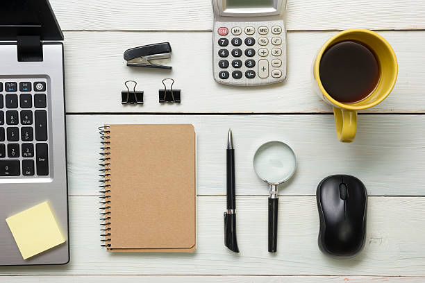 istock Office desk table with supplies and coffee cup. Top view 517058366