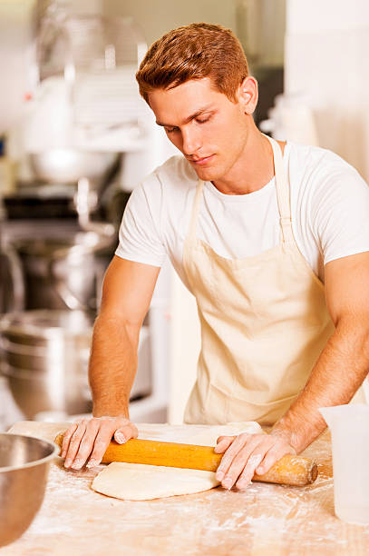 Rolling out the dough.