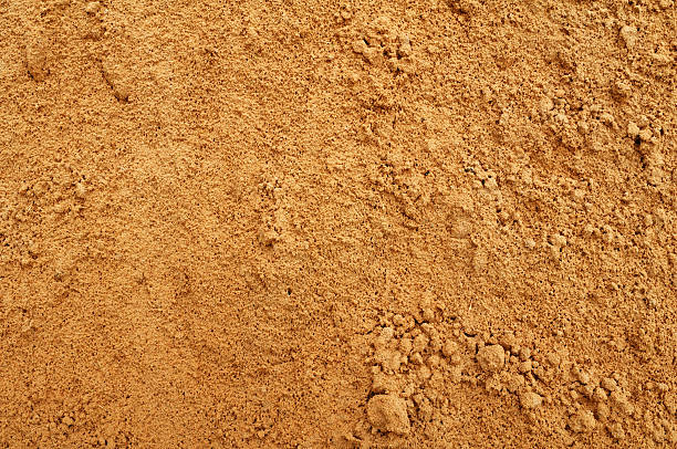 istock Texture of old wall covered with yellow stucco 517061069