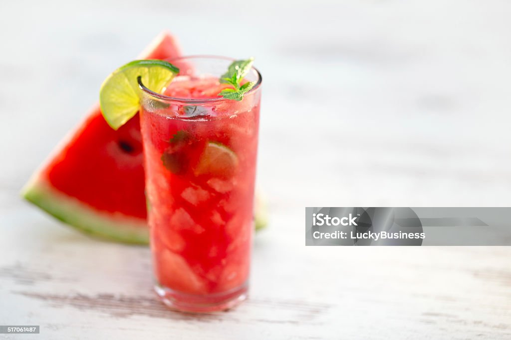glass of watermelon juice Watermelon juice with mint leaves and lime citrus Citrus Fruit Stock Photo