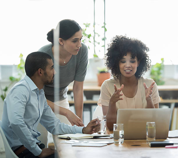 She's excited about her new project Cropped shot of a group of business colleagues meeting in the boardroom leanincollection stock pictures, royalty-free photos & images