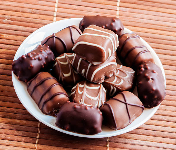 istock chocolate pralines on old wooden table 517074204