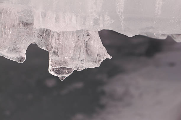 istock Icicles on ice of the thawing river in the spring 517074320