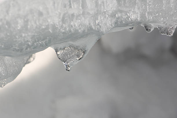 istock Icicles on ice of the thawing river in the spring 517074726