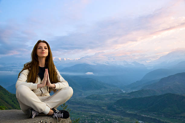 istock Young woman meditating 517075369