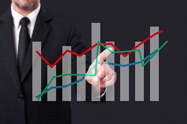 istock Business manager touching an oscillating financial chart on virt 517075964
