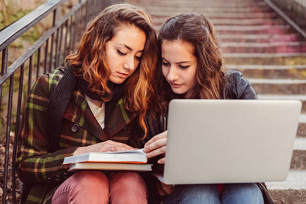 istock Young girls doing the homeworks together 517076890