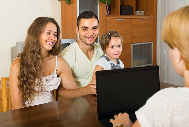 istock Banking assistant and satisfied family 517077679
